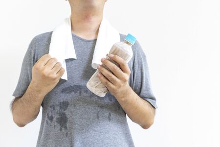 Man with plastic bottle of frozen tea