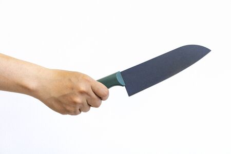 Woman's hand holding a kitchen knife