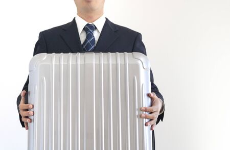 Man in suits with suitcasesの写真素材