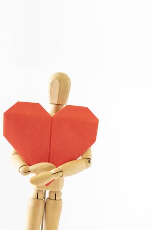 Origami heart and drawing dollの写真素材