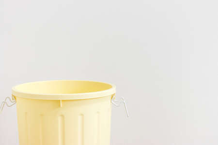 Yellow 45L trash can on white backgroundの写真素材