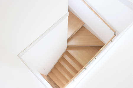 Stairs in a wooden house taken from aboveの写真素材