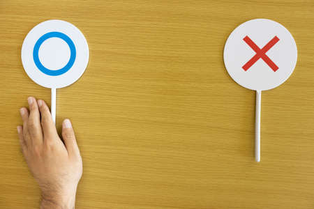 Image of a man's hand making a choice