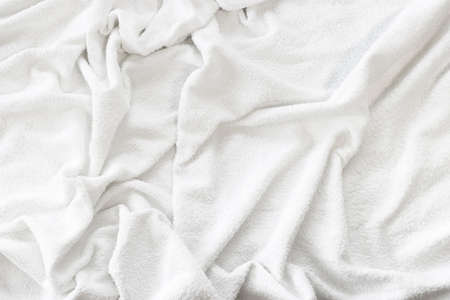 Background material with a white towel full of wrinklesの写真素材