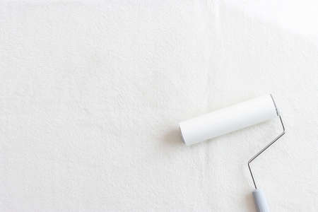 White carpet and lint rollerの写真素材