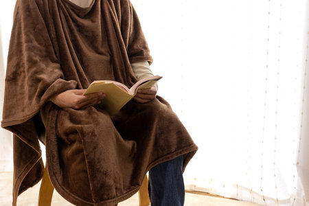 A man reading in a warm fashionの写真素材