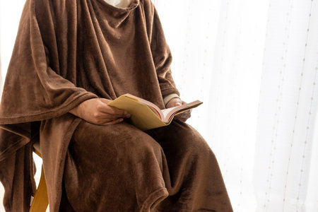 A man reading in a warm fashionの写真素材