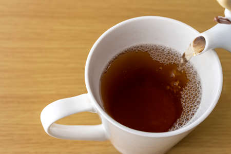 Image of putting tea in a cupの写真素材