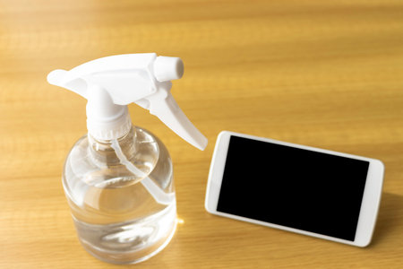 Image of disinfecting smartphones with alcoholの写真素材