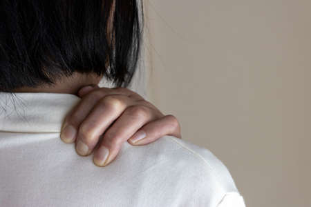 Image of senior women with stiff shoulders (Japanese, 60s, elderly)の写真素材