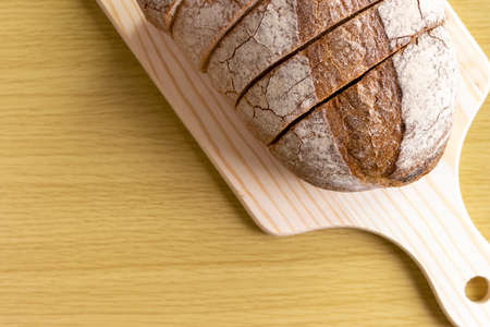 Cut French bread sprinkled with rye flourの写真素材