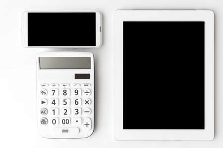 Calculators, tablets and smartphones. Digital device cost imageの写真素材
