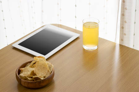 Image of eating a snack during breaks and using a tablet device