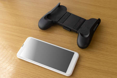 Smartphone with a grip stand for games