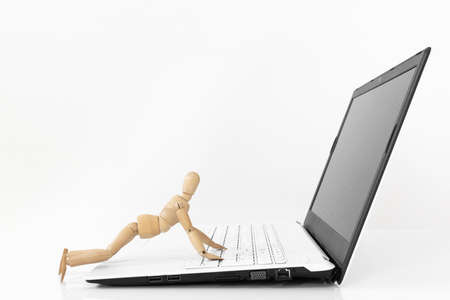 An image of a drawing doll operating a laptop computer. Robotic Process Automation (RPA) Image