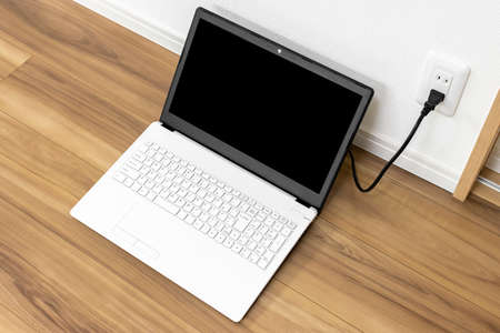 Image of charging a laptop