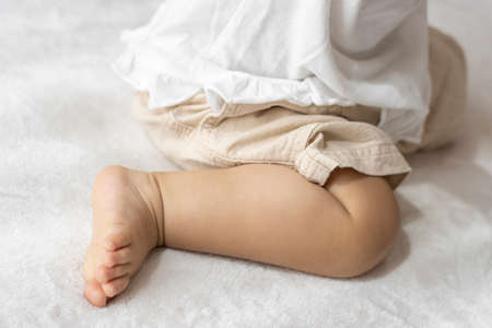 Sitting baby's feet (1 year and 2 months old, girl, Japanese)の写真素材
