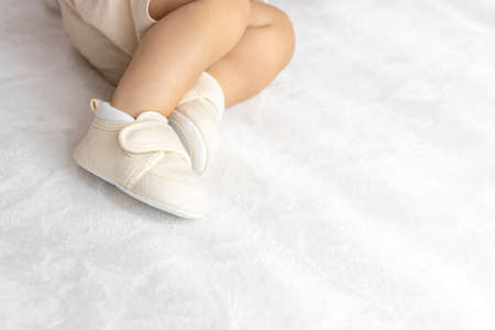 Lying baby's feet in shoes (1 year and 2 months old, girl, Japanese)の写真素材