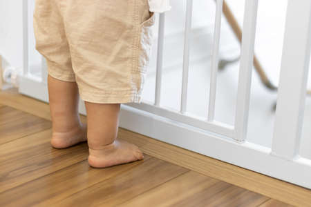 Baby gate and baby's feet (1 year and 2 months old, girl, Japanese)