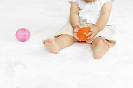 Sitting baby and Capsule toys(1 year and 2 months old, girl, Japanese)