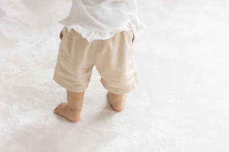 Baby's feet that stood up (1 year and 2 months old, girl, Japanese)の写真素材
