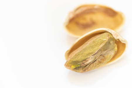 Pistachio with visible contents (white background)の写真素材