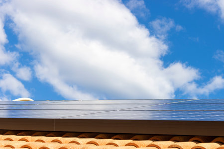 Roof with solar panels and blue skyの写真素材