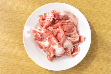 Cut off raw pork on a plateの写真素材
