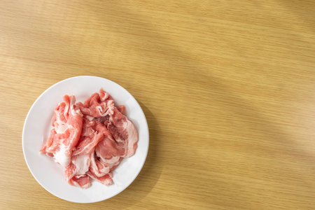 Cut off raw pork on a plateの写真素材