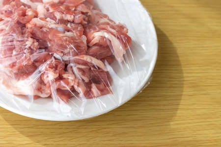 Pork on a plate and wrappedの写真素材