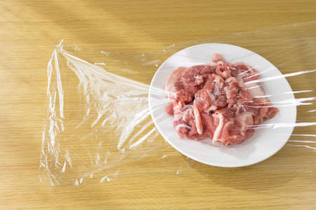 Pork on a plate and wrappedの写真素材