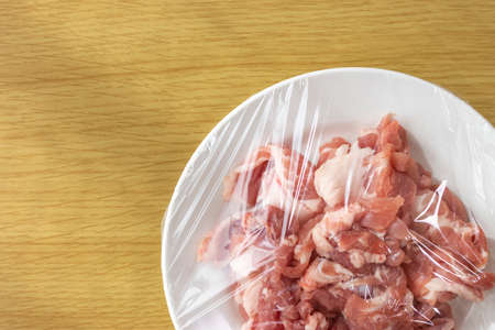 Pork on a plate and wrappedの写真素材