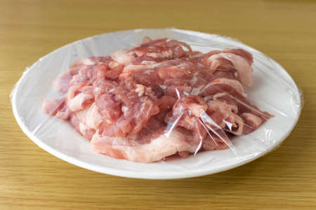 Pork on a plate and wrappedの写真素材