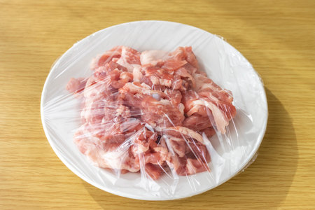 Pork on a plate and wrappedの写真素材