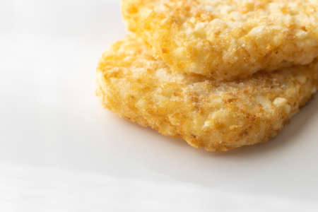 Hashed potatoes fried and then frozenの写真素材