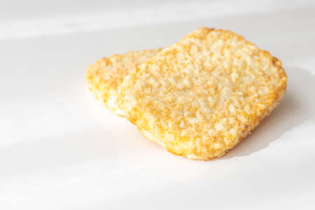 Hashed potatoes fried and then frozenの写真素材