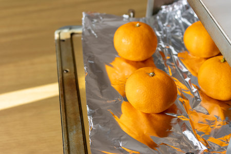Image of baking oranges in an oven toasterの写真素材