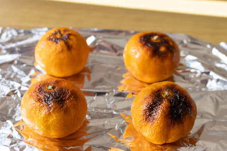 Grilled oranges placed on the tableの写真素材