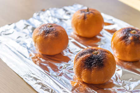 Grilled oranges placed on the tableの写真素材