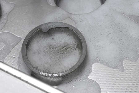 Image of cleaning the kitchen sink with foam detergentの写真素材