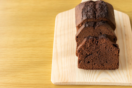 Image of cutting chocolate pound cake with a cutting board. Valentine's day image.の写真素材