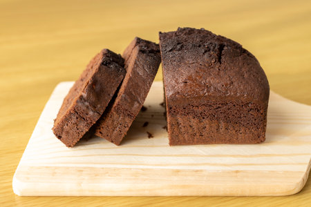 Image of cutting chocolate pound cake with a cutting board. Valentine's day image.の写真素材