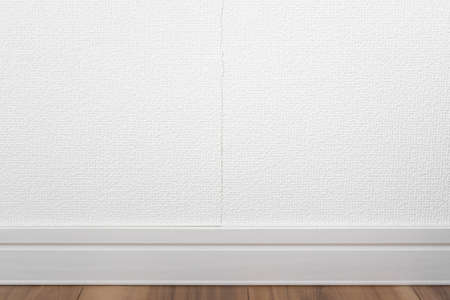 Photo of cracked white wallpaperの写真素材