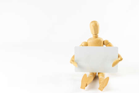 Image of a doll shopping with a credit cardの写真素材