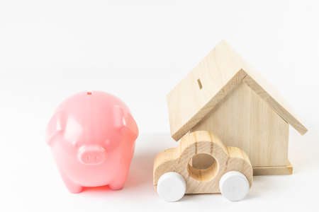 Piggy bank, toy house and car