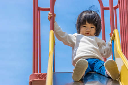 Baby playing on the slide (1 year and 10 months old, girl, Japanese)