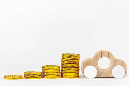 Toy car and gold coinsの写真素材