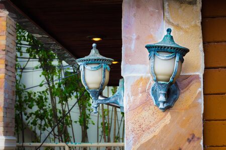 The two lamps on the pole.