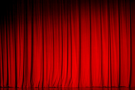 Red curtains in a theater scene of the show.の写真素材