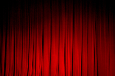 Red curtains in a theater scene of the show.の写真素材